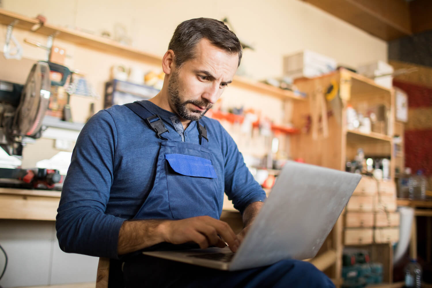 man managing small business